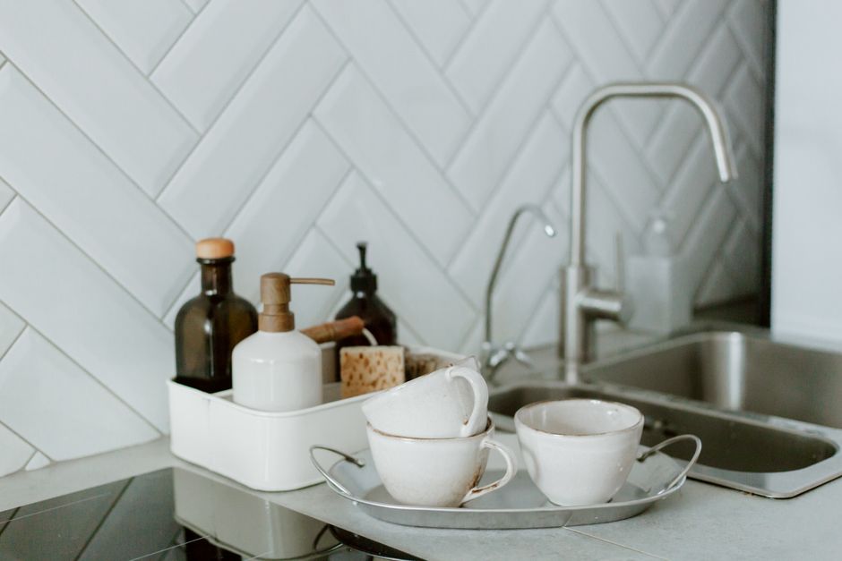 A clean and organized kitchen counter setup for baby feeding essentials