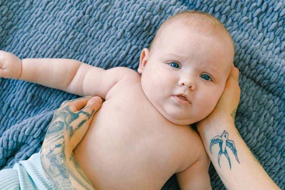 A mother gently cradling and soothing her baby