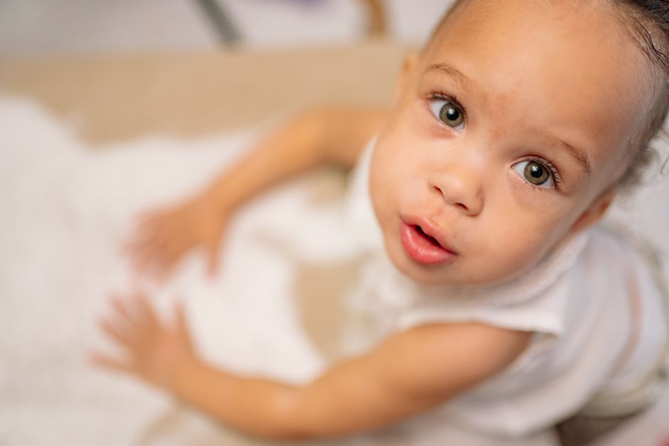 Close-up of curious infant exploring surroundings