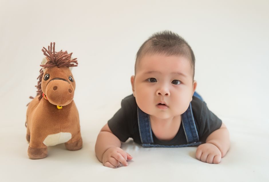 Baby crawling and developing motor strength