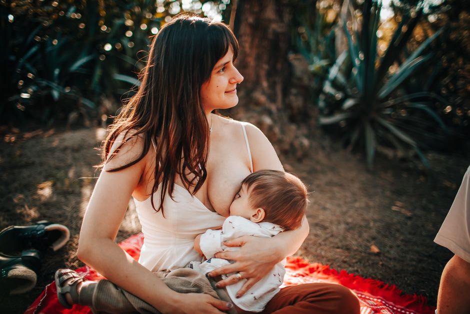 A mother breastfeeding her newborn baby peacefully