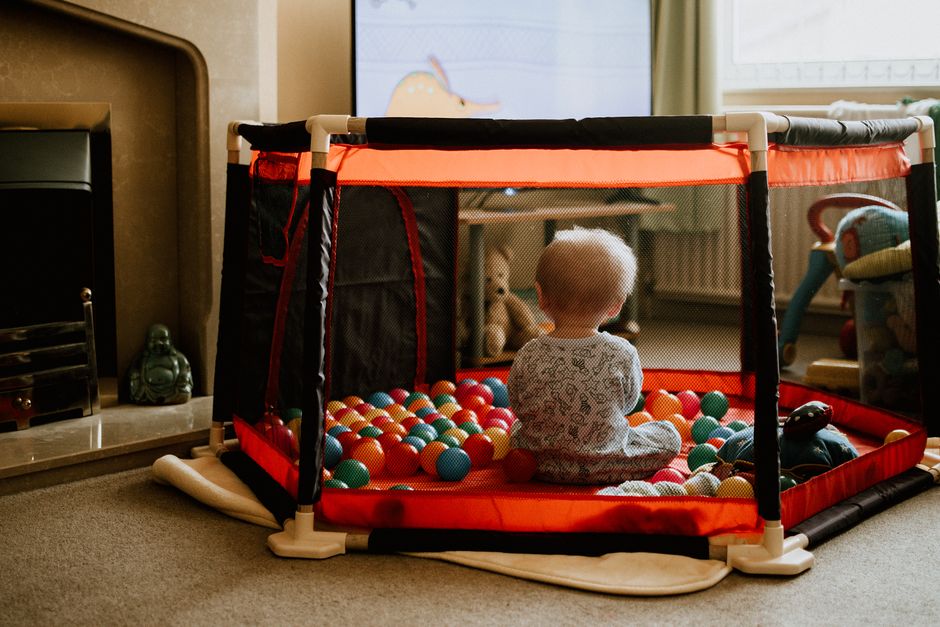 Baby playing safely in an indoor play area