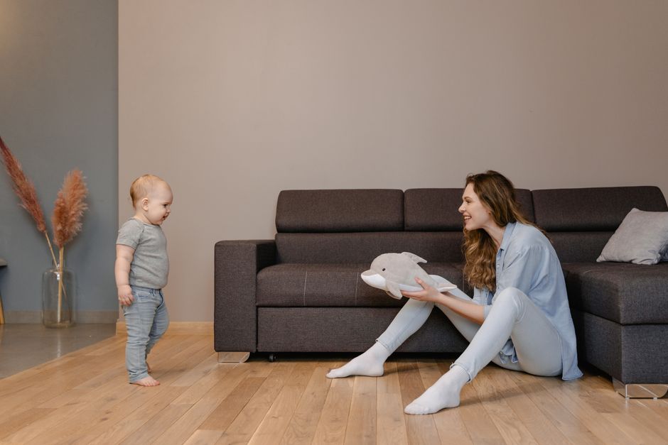 Mother talking closely to baby on change table