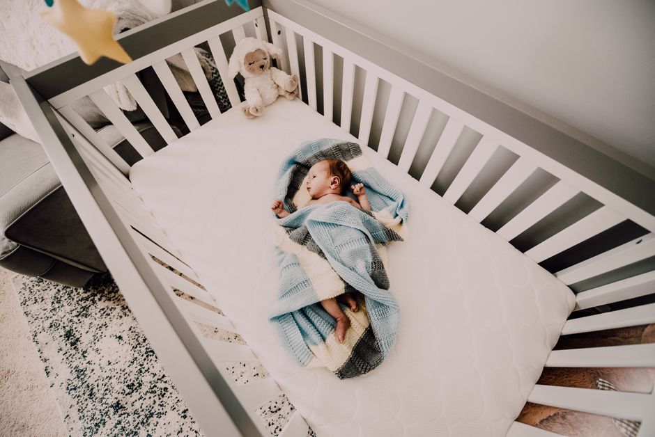 Cozy newborn nursery with safe crib and minimalist decor