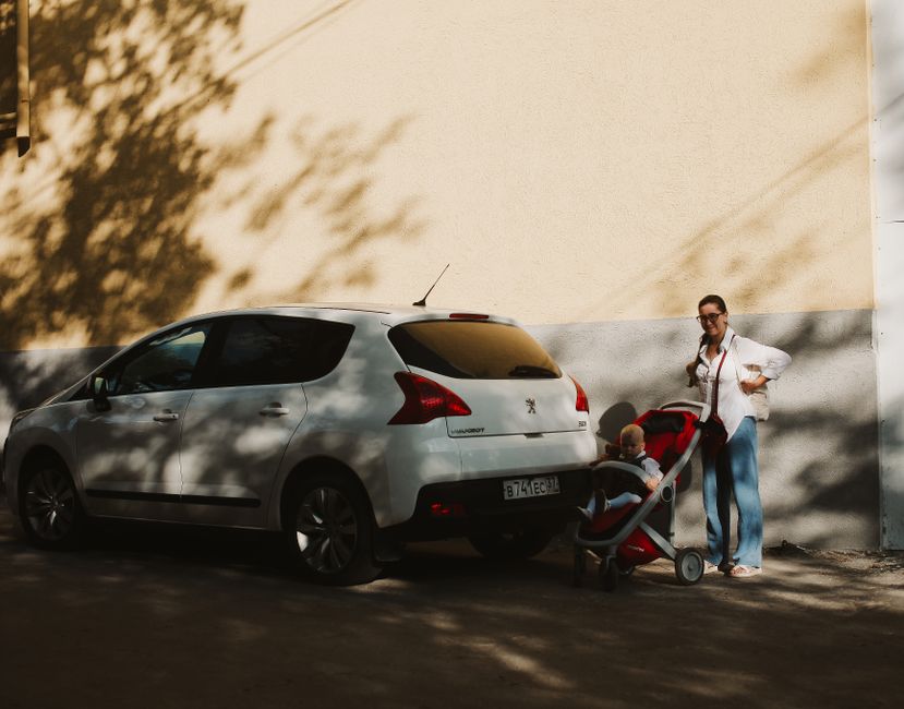Mother walking with a stroller in safe shaded areas