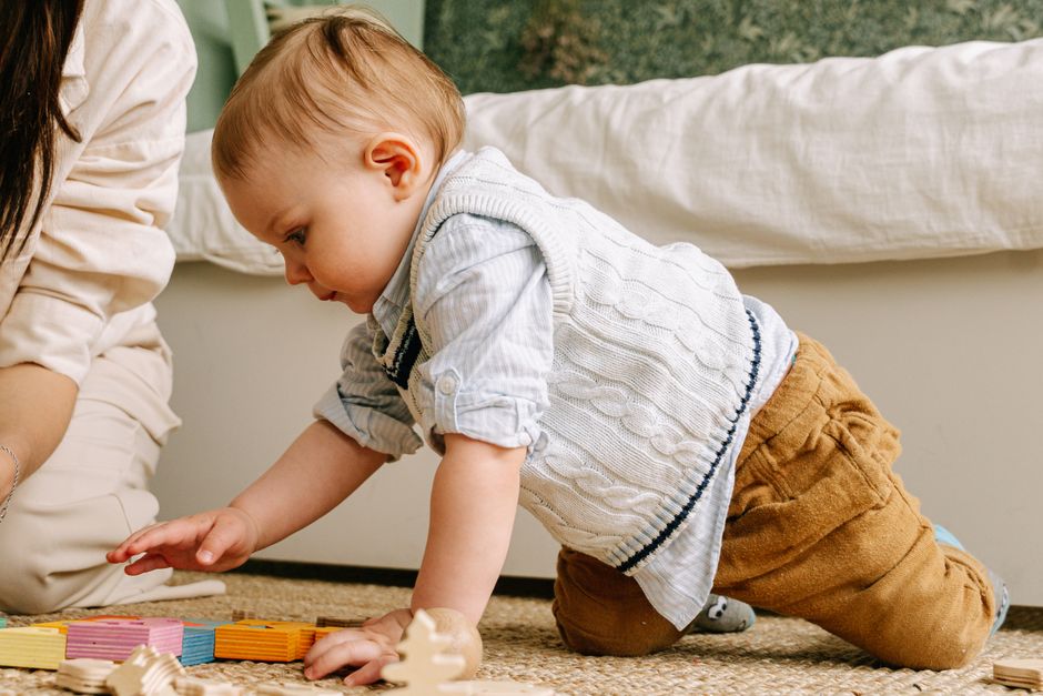 Child playing in safe environment free of small battery hazards