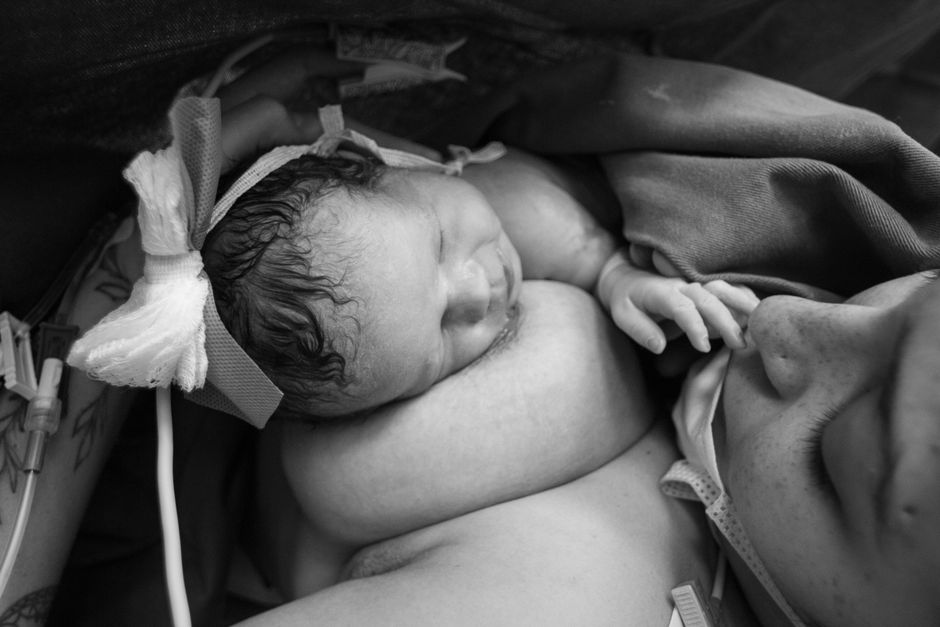 Tender intimate moment of a postpartum mother resting and caring for her health
