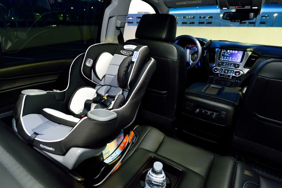 Interior of car with child safety seat installed properly
