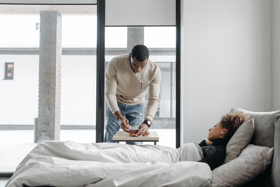 A partner caring for a recovering mother at home