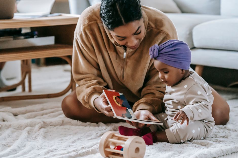 Mother reading to her child in a cozy bedroom