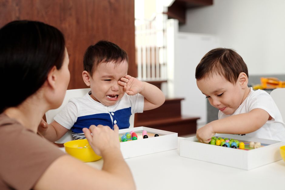 A mother connecting calmly with her toddler to soothe big emotional meltdowns