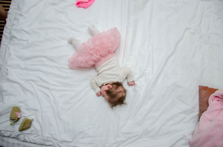 A serene baby sleeping comfortably indoors