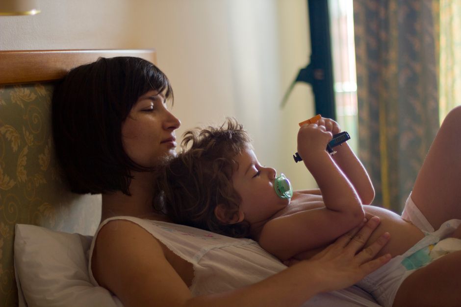 Mother and toddler enjoying a relaxed, comfortable moment at home