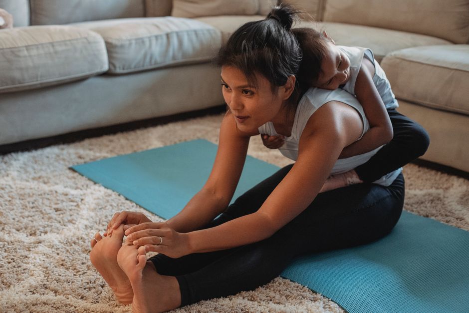 Mother practicing healthy movement with toddler