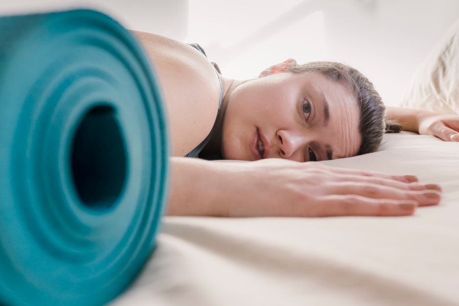 A woman resting and taking time for gentle core and pelvic rehabilitation