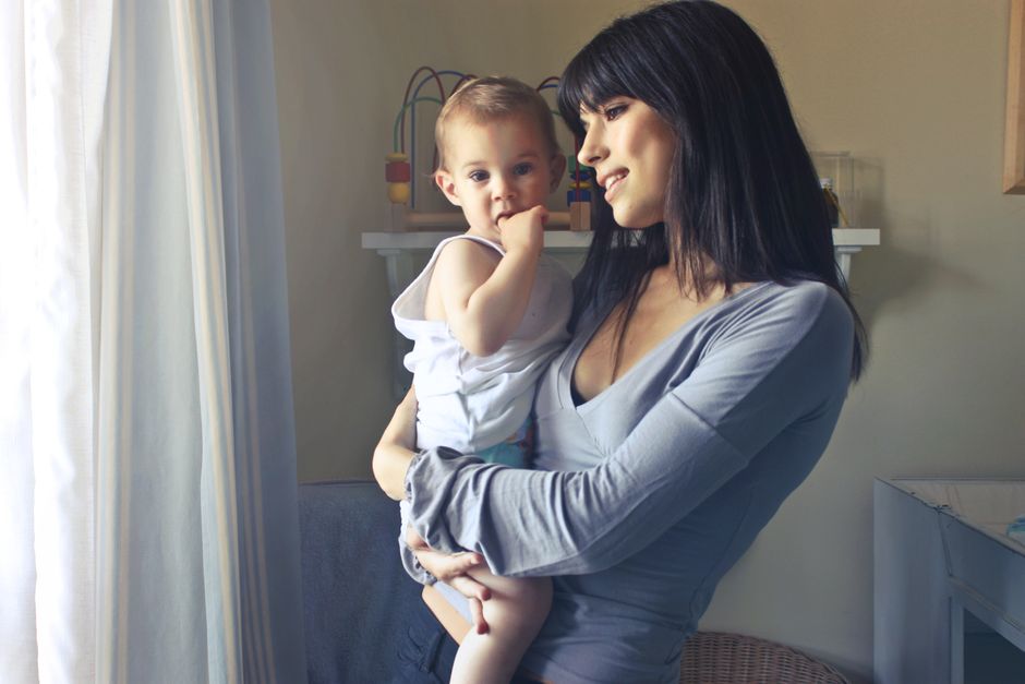 A loving moment between a mother and her child in an indoor setting, fostering connection and warmth
