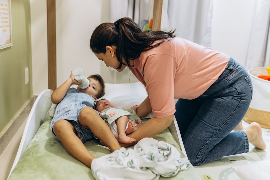 A mother tending to her children in a peaceful nursery setting
