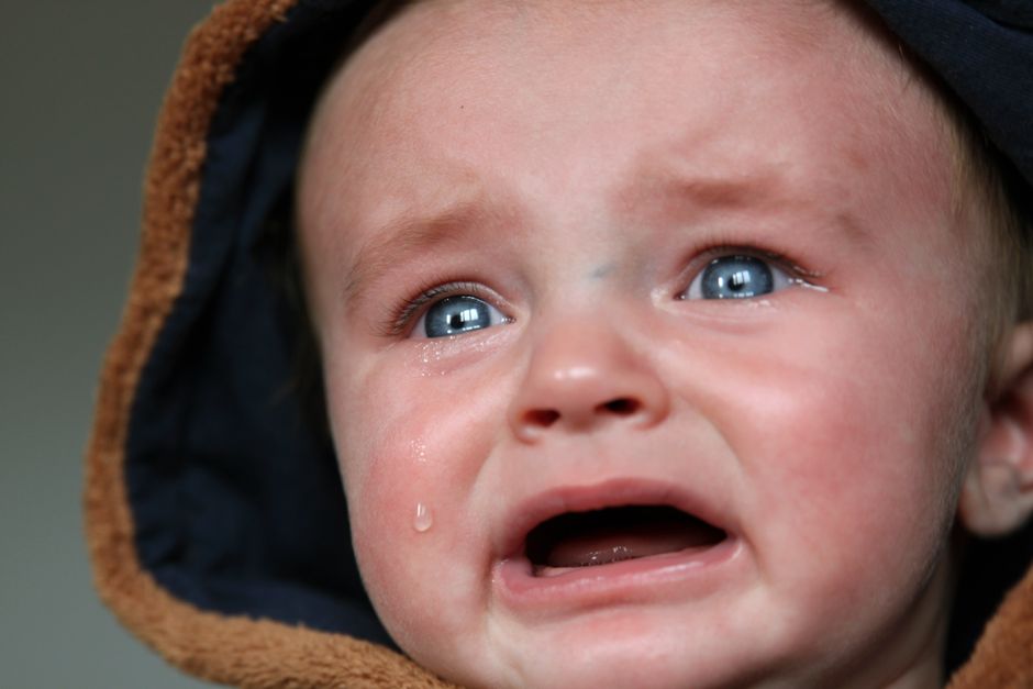 Emotional close-up of a child in tears processing big feelings