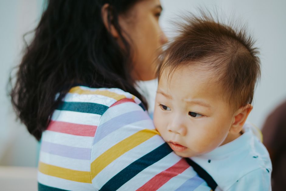 Mother explaining boundaries to toddler in living room