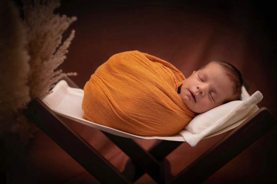 Baby peacefully asleep in a safe sleep space