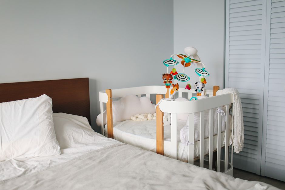 Minimalist safe nursery crib with empty mattress